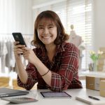 Portrait young attractive hipster asia female owner startup look at camera work