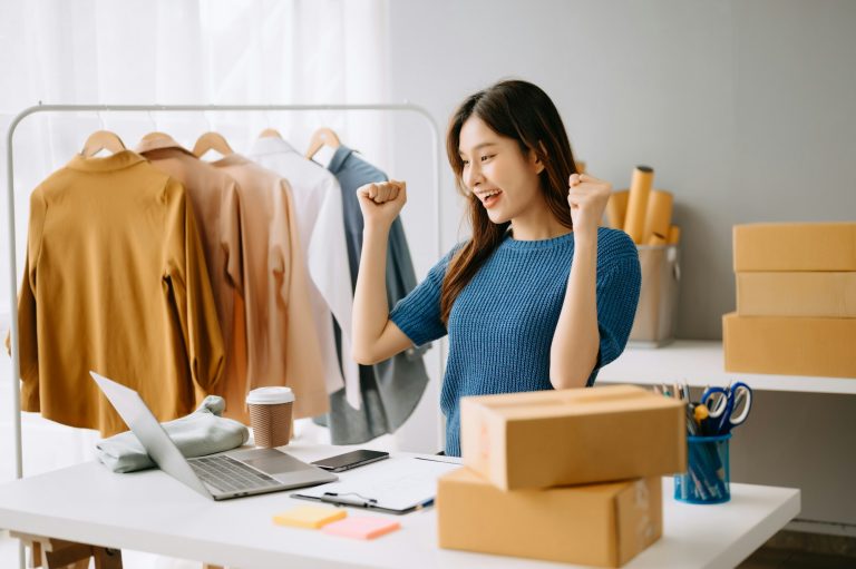Woman working at office, BOX, tablet and laptop online, marketing, packaging, delivery, e-commerce