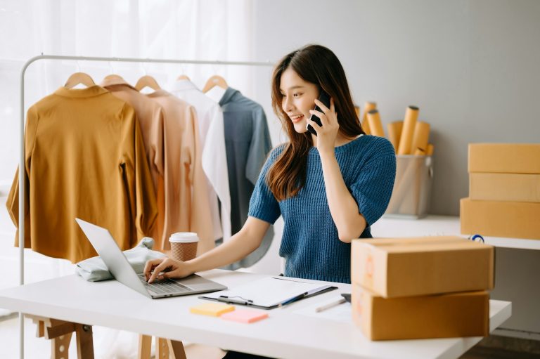 Woman working at office, BOX, tablet and laptop online, marketing, packaging, delivery, e-commerce