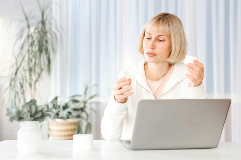 Beauty blogger working with laptop
