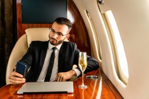 Businessman flying on private jet