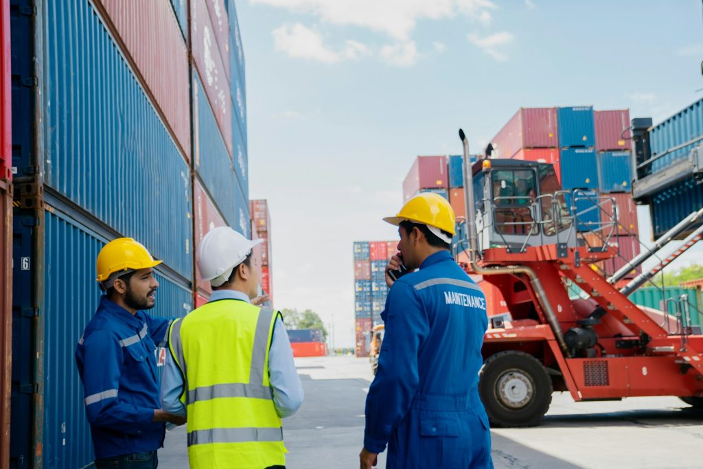 Foreman control loading Containers box to truck for Logistic Import Export.