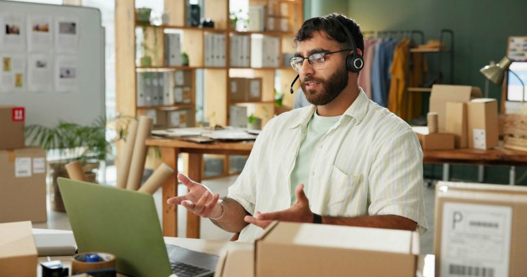 Man, call center and talking on laptop for delivery, cargo or track shipping on online shopping hel