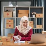 Muslim Woman online store small business owner seller entrepreneur packing package post shipping box