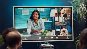 Project management team attending videocall meeting with shareholders