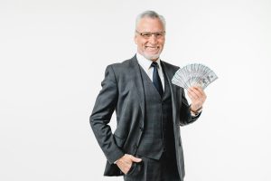 Successful millionaire lottery casino bets winner holding money prize victory jackpot