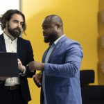 Team of corporation employees preparing their pitch for the shareholders meeting