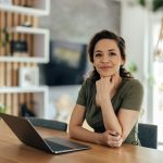 Young woman, making sure she looks good for the picture.