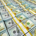 Background - rows of US dollars bundles