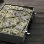 Briefcase with dollars.