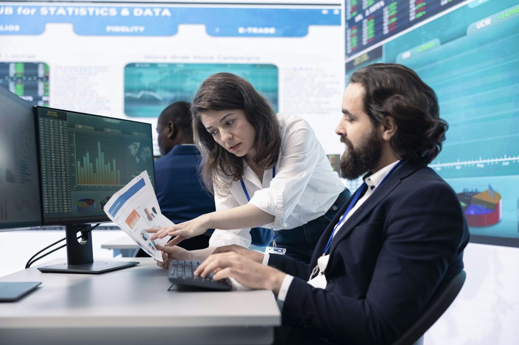 Business analysts team working together to evaluate costs