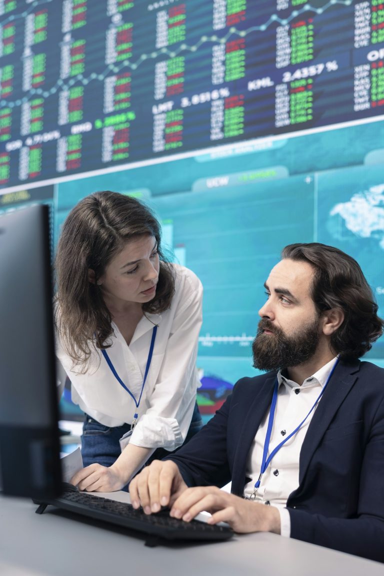 Business associates comparing key performance indicators