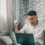 Businessman celebrating market business going well making money. Trader