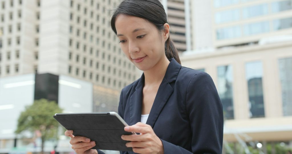 Businesswoman use of tablet computer at outdoor