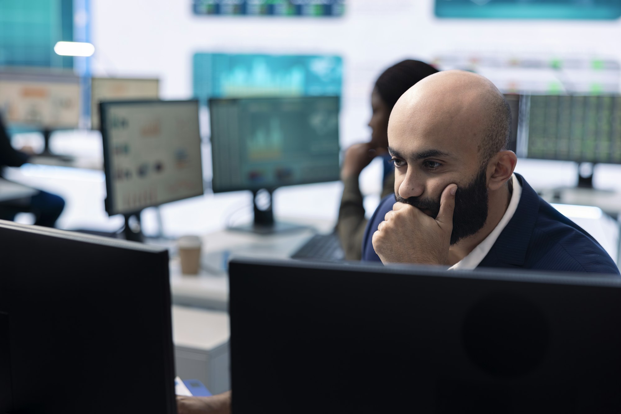 Enterprise manager looking into project updates and details in monitoring room