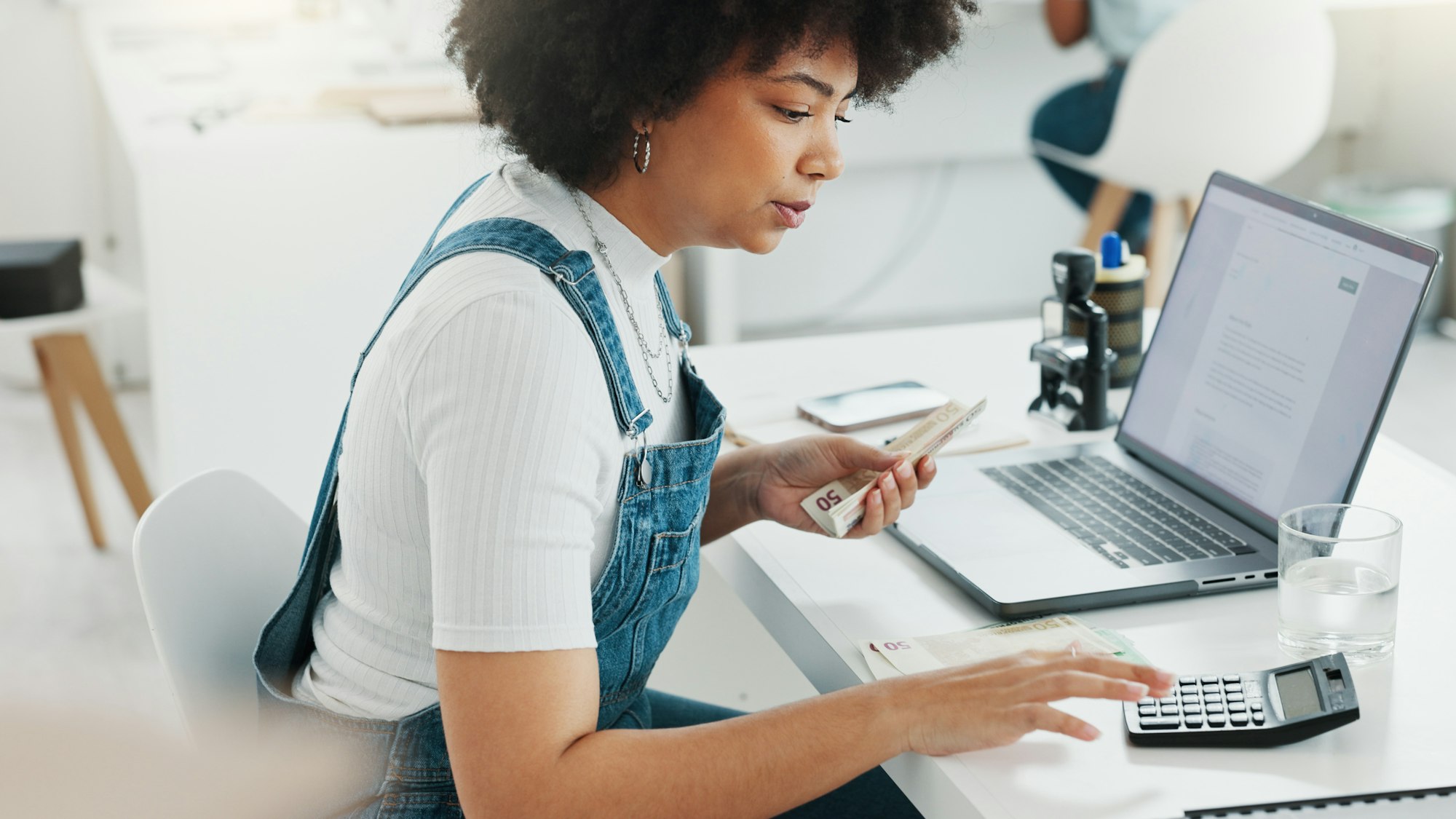 Money, finance or woman with laptop or startup budget in digital marketing, creative or design offi