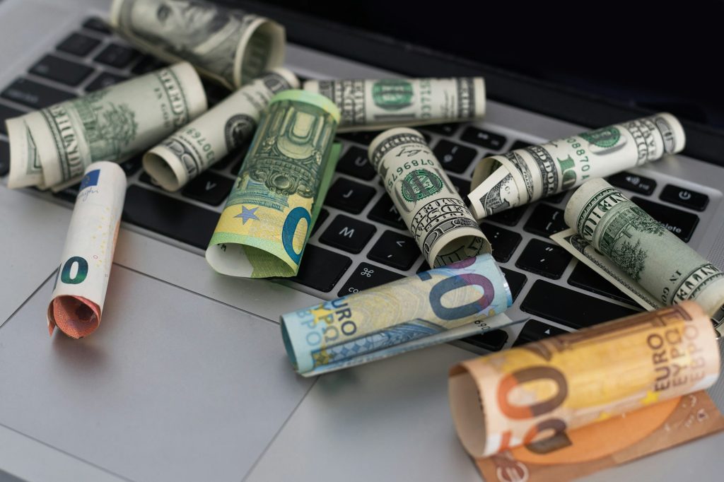 US dollars in closeup on laptop.